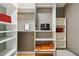Walk-in closet featuring custom shelving, organization, and plenty of space for storage at 824 Palm Cove Dr, Orlando, FL 32835