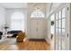 Bright foyer showcases soaring ceilings, hardwood floors, and grand double doors at 824 Palm Cove Dr, Orlando, FL 32835