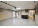 Spacious garage with plenty of storage space, painted walls, and epoxy floor at 824 Palm Cove Dr, Orlando, FL 32835
