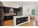Modern kitchen featuring sleek cabinetry, stainless steel appliances, and a spacious island at 824 Palm Cove Dr, Orlando, FL 32835