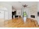 Open living room features a stone fireplace, a ceiling fan, and access to outdoor space at 824 Palm Cove Dr, Orlando, FL 32835