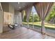 Sunroom overlooking backyard featuring tiled floors and lots of natural light at 824 Palm Cove Dr, Orlando, FL 32835