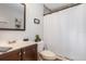 Well-lit bathroom with vanity, framed mirror, and shower-tub combination at 8711 Rockingham Ter # A, Kissimmee, FL 34747
