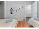 Comfortable bedroom with twin beds, decorative wall art and organized closet at 8711 Rockingham Ter # A, Kissimmee, FL 34747