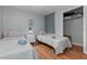 Bright bedroom with two twin beds, hardwood floors, and closet space at 8711 Rockingham Ter # A, Kissimmee, FL 34747