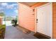 Exterior view of entrance showcasing unit number, well-maintained landscaping, and the inviting front door at 8711 Rockingham Ter # A, Kissimmee, FL 34747