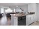 Open concept kitchen and living area with granite countertops and stainless steel dishwasher at 8711 Rockingham Ter # A, Kissimmee, FL 34747