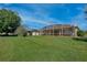 Lush backyard featuring a screened lanai offers scenic views at 9102 Shadowbrook Trl, Orlando, FL 32825