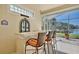 Lanai wet bar with seating offers a lakeside entertainment space at 9102 Shadowbrook Trl, Orlando, FL 32825