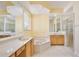 Spacious bathroom with dual vanities, soaking tub, and glass-enclosed shower provides a spa-like experience at 9102 Shadowbrook Trl, Orlando, FL 32825