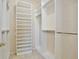 Walk-in closet with custom shelving and hanging racks offers ample storage space at 9102 Shadowbrook Trl, Orlando, FL 32825