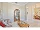 Comfortable living room featuring traditional furnishings, neutral paint, and a display cabinet at 9102 Shadowbrook Trl, Orlando, FL 32825