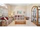Cozy living room featuring traditional furnishings, neutral paint, and lots of natural light at 9102 Shadowbrook Trl, Orlando, FL 32825
