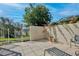Private patio with tiled surface, partial wall and seating offers a relaxing outdoor space at 9102 Shadowbrook Trl, Orlando, FL 32825