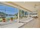 Spacious screened patio with a view of a tranquil lake and lush landscaping at 9102 Shadowbrook Trl, Orlando, FL 32825