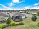 Aerial view of a home in a neighborhood with lush landscaping and sidewalks at 937 Avery Meadows Way, Deland, FL 32724