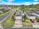 Aerial view of a well-maintained home with a paved driveway in a lovely neighborhood at 937 Avery Meadows Way, Deland, FL 32724