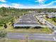 Aerial view of homes lined along a neighborhood street with mature trees and lush landscaping at 937 Avery Meadows Way, Deland, FL 32724
