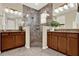 Modern bathroom featuring a glass-enclosed shower, dual sinks, and updated fixtures at 937 Avery Meadows Way, Deland, FL 32724