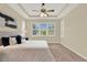 Bright bedroom features a large window with a view and neutral tones at 937 Avery Meadows Way, Deland, FL 32724