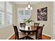 Inviting breakfast nook with plantation shutters providing natural light and stylish decor at 937 Avery Meadows Way, Deland, FL 32724