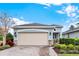 Charming single-Gathering home featuring a two-car garage, lovely landscaping, and a welcoming exterior at 937 Avery Meadows Way, Deland, FL 32724