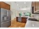 Spacious kitchen showcasing stainless steel appliances, modern finishes, and an open concept design at 937 Avery Meadows Way, Deland, FL 32724