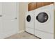 Bright laundry room with front load washer and dryer for ease of use when doing laundry at 937 Avery Meadows Way, Deland, FL 32724