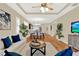 Bright, open living area with hardwood floors, ceiling fan, and nearby dining at 937 Avery Meadows Way, Deland, FL 32724