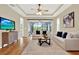 Comfortable living room with large windows and a tray ceiling at 937 Avery Meadows Way, Deland, FL 32724