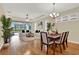 Open-concept living room with hardwood floors and sliding glass doors to screened patio at 937 Avery Meadows Way, Deland, FL 32724