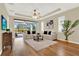 Bright living room with plush rug and access to an outdoor screened-in patio at 937 Avery Meadows Way, Deland, FL 32724