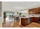 Open-concept living space featuring a spacious kitchen, dining area, and comfortable living room at 937 Avery Meadows Way, Deland, FL 32724