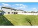 Large backyard area with a white privacy fence, offering plenty of space for outdoor enjoyment and entertainment at 965 Talon Pl, Winter Springs, FL 32708