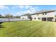 Expansive backyard featuring lush green grass and a privacy fence, perfect for outdoor activities and relaxation at 965 Talon Pl, Winter Springs, FL 32708