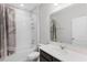 Well-lit bathroom with a shower-tub combo and a vanity with a solid surface countertop at 965 Talon Pl, Winter Springs, FL 32708
