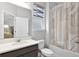Bathroom featuring sink, toilet, shower, and a mirror at 965 Talon Pl, Winter Springs, FL 32708