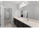 Bright bathroom featuring double sinks and a large mirror at 965 Talon Pl, Winter Springs, FL 32708