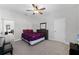 Bedroom with a ceiling fan, carpet, and a purple comforter at 965 Talon Pl, Winter Springs, FL 32708