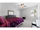 Bedroom with a ceiling fan, carpet, and a window at 965 Talon Pl, Winter Springs, FL 32708