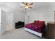 Bedroom with a ceiling fan, carpet, and an open doorway at 965 Talon Pl, Winter Springs, FL 32708