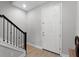 Inviting entryway with modern staircase and stylish front door, creating a warm welcome at 965 Talon Pl, Winter Springs, FL 32708