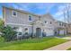 Charming two-story home with a well-manicured lawn, a two-car garage, and a welcoming front entrance at 965 Talon Pl, Winter Springs, FL 32708