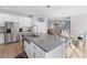 Spacious kitchen and dining area with stainless appliances and a seamless flow to the living room at 965 Talon Pl, Winter Springs, FL 32708