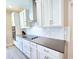 Charming kitchen featuring white cabinets, stainless steel appliances, and sleek countertops for a modern cooking space at 965 Talon Pl, Winter Springs, FL 32708