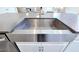 Contemporary kitchen sink with stainless steel basin and fixtures, adding a touch of modern elegance to the space at 965 Talon Pl, Winter Springs, FL 32708