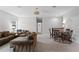 Spacious upstairs living room featuring a comfortable seating area and a dining table at 965 Talon Pl, Winter Springs, FL 32708