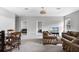 Open-concept living area with neutral walls, a dining table, and views to other bedrooms at 965 Talon Pl, Winter Springs, FL 32708