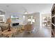 Bright living room featuring elegant furniture, stylish decor, and seamless access to the outdoor space at 965 Talon Pl, Winter Springs, FL 32708