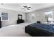 Bright main bedroom featuring neutral walls, a ceiling fan and natural light from two windows at 965 Talon Pl, Winter Springs, FL 32708